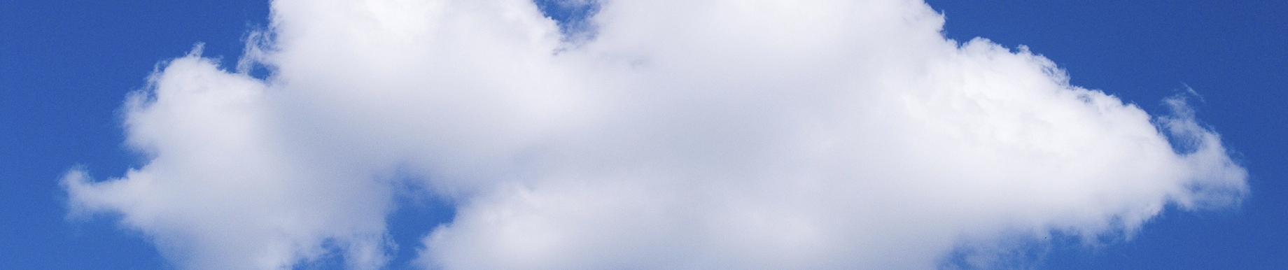 A Single White Cloud Against A Blue Sky
